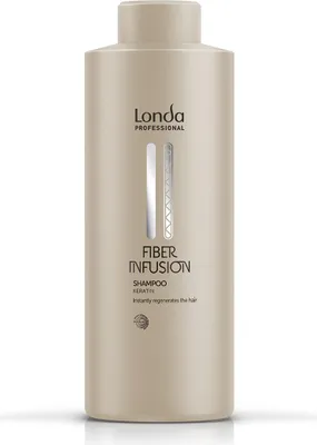A product shot of a shampoo bottle against a white background.