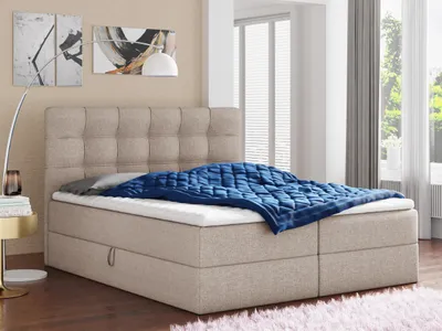 A bedroom scene with a bed as the main focus.