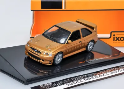 Zdjęcie produktu dla Ford Escort RS Cosworth Customs - jasnobrązowy metalik IXO 1:43