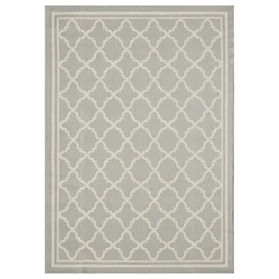 A flat lay image of a rectangular rug with a geometric pattern.