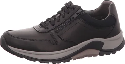 A side view of a black leather men's shoe with a gray sole.