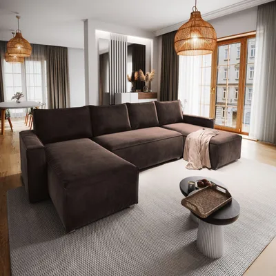 A spacious living room with a large brown sectional sofa.