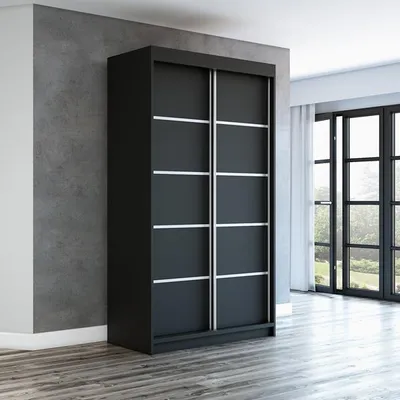 A black sliding door wardrobe is shown in a room with a concrete wall and wooden floor.