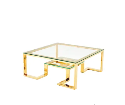 A square glass coffee table with a gold metal frame, shown from a side angle against a white background.