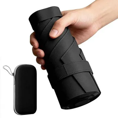 Produktbild von Kompakter, wind- und wasserdichter, tragbarer Sonnenschirm für Reisen, Mini-Größe, UPF 50+ Schutz, in Tasche verstückbar.