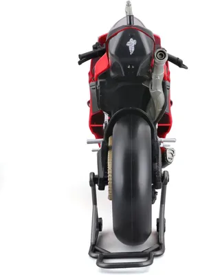 The rear view of a red and black model motorcycle on a stand.