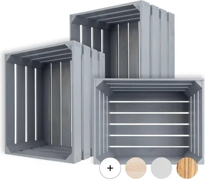 Three grey wooden crates of varying sizes are stacked and arranged in a studio setting against a white background.