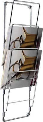 A chrome magazine rack mounted on a white background.