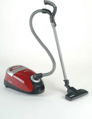 A red and black toy vacuum cleaner is shown against a white background.
