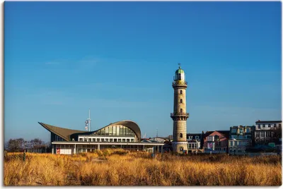 Produktbild von ARTland Leinwandbild Leuchtturm mit Teepott in Warnemünde I Größe: 60x40 cm