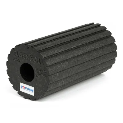 A black foam roller with ridges, shown on a white background.