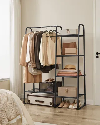 A clothing rack and shelving unit filled with clothes, accessories, and storage boxes, in a bedroom setting.