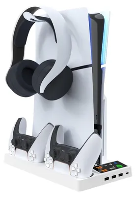 A white charging and cooling stand for a PS5 Slim console, with headphones and two controllers docked.