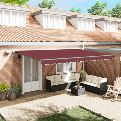 A patio area with outdoor furniture and a retractable awning.