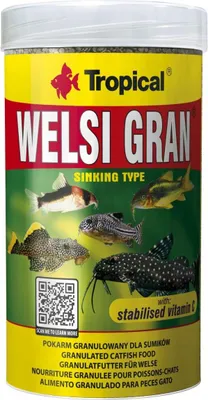 A cylindrical container of fish food with images of fish on it.