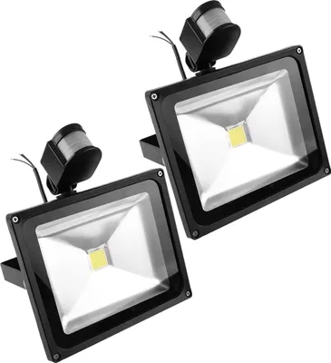 Two black LED floodlights with motion sensors are shown against a white background.