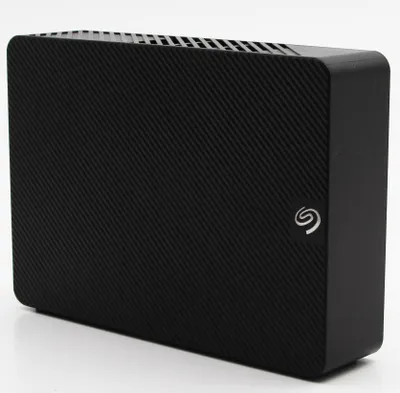 A black Seagate external hard drive is shown against a white background.