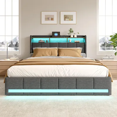A bedroom scene featuring a bed with built-in lighting and storage.