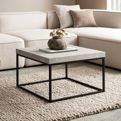 A modern living room setting with a couch and a coffee table.
