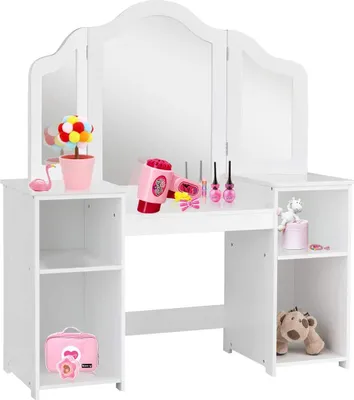 A white children's vanity table with a tri-fold mirror and various toy accessories.