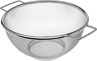 A stainless steel kitchen colander with two handles, shown from a slightly elevated side angle against a white background.