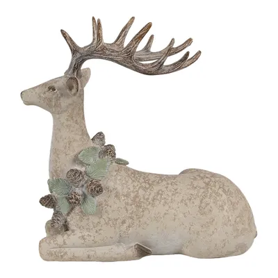 A decorative figurine of a deer with antlers, adorned with pine cones and leaves.