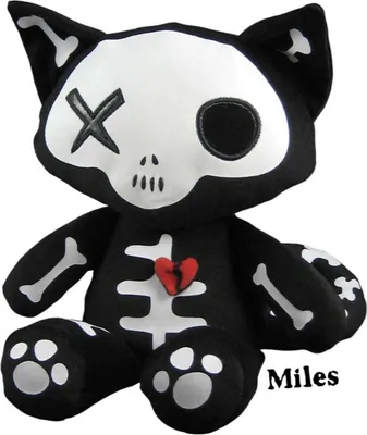 A plush toy cat with a skeleton design and a broken heart.