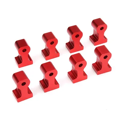 A set of eight red metal corner clamps arranged in two rows on a white background.