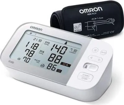 A digital blood pressure monitor and its cuff are shown against a white background.