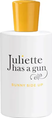 A white bottle of perfume with a yellow cap and text on the front.