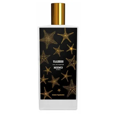 A perfume bottle with a black label featuring gold starfish.