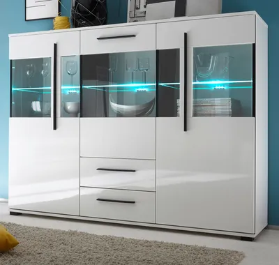 A white highboard with glass doors and blue LED lighting, set against a blue wall.