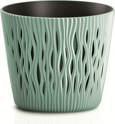 A close-up studio shot of a decorative planter pot.