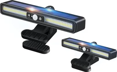 Two solar-powered clip-on lights with motion sensors are displayed against a white background.