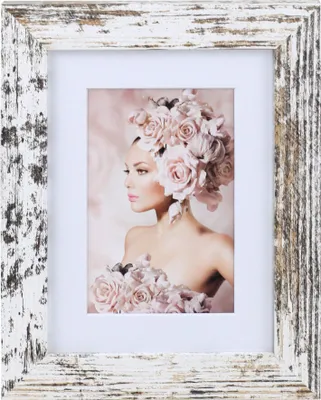 A framed picture of a woman with a floral headdress.