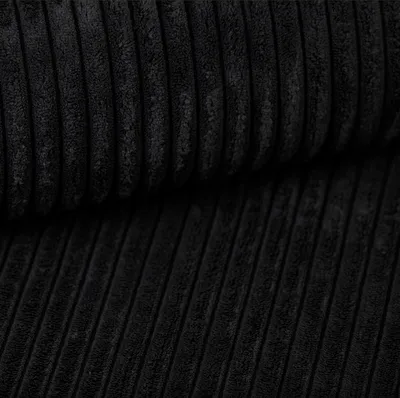 Close-up of black corduroy fabric.