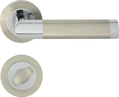 A door handle set with a round rosette and a separate toilet lock mechanism.