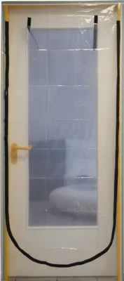 A clear plastic dust protection door with a zipper attached to a white door frame.