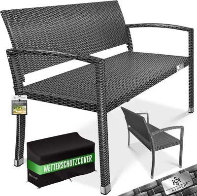 A dark grey rattan garden bench with a black protective cover and a smaller bench in the background.
