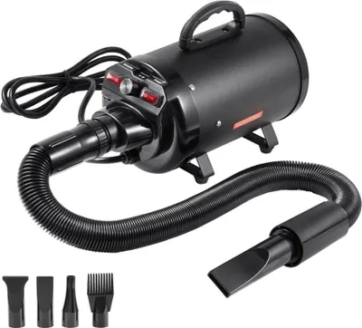 A black pet dryer with a hose and multiple nozzle attachments, displayed on a white background.