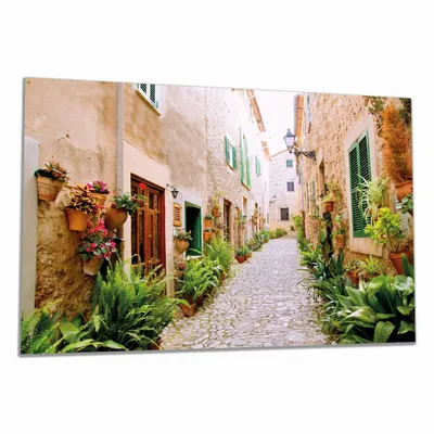 Produktbild von Wallario Herdabdeckplatte aus Glas, Größe 80 x 52 cm 1-teilig, Motiv Südländische Gasse mit alten Häusern und grüner Oase