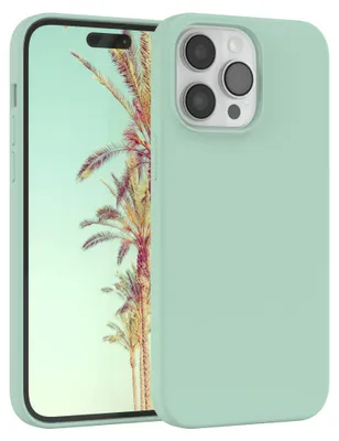 A light green silicone phone case for an iPhone 14 Pro Max is shown with a tropical background on the phone screen.
