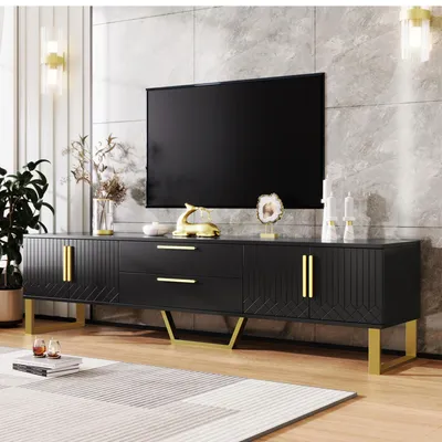 A modern living room setting with a TV stand and a large television.