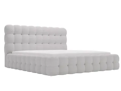 A light gray upholstered bed frame with a tufted headboard and footboard, shown from a side angle on a white background.