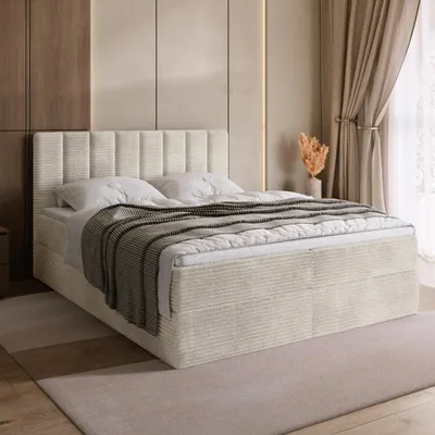 A bedroom scene with a bed as the main focus.