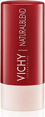 A close-up product shot of a red and white lip balm tube.