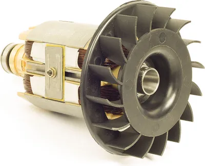 A close-up studio shot of a generator rotor with a fan attached.