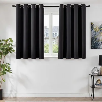 Immagine prodotto di Tende oscuranti nere Unyqoos® (set da 2) con passanti – poliestere, oscuranti, isolanti termicamente e acusticamente