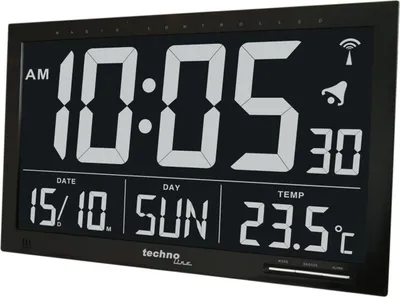 A digital wall clock displaying the time, date, day, and temperature.