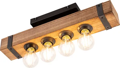 A close-up, angled view of a wooden ceiling light fixture with four exposed bulbs.